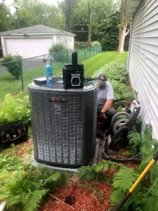 Customer service representative consulting with a homeowner about air conditioning options